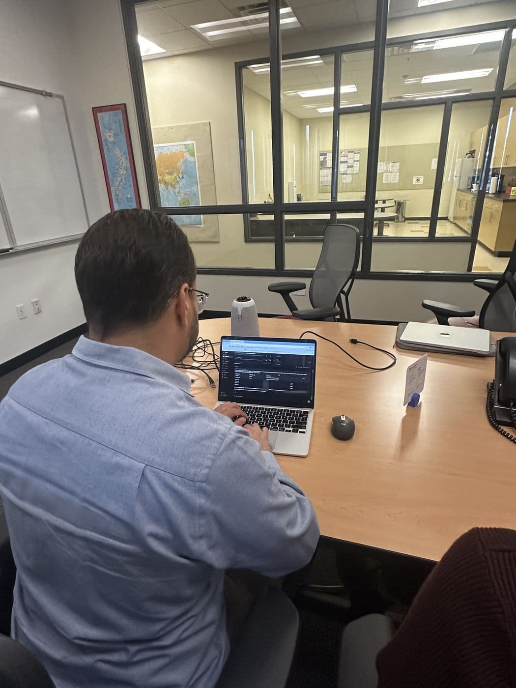 Yoel Roznitsky reviewing a document with a colleague